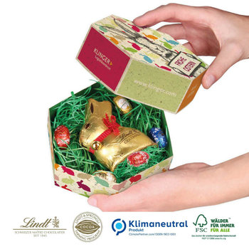 Großes Osternest mit Schokolade von Lindt auf Graspapier